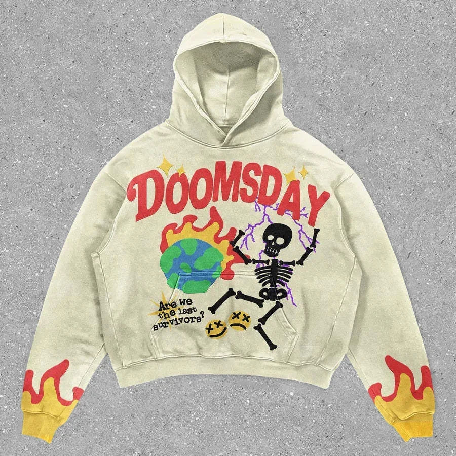 A beige Explosions Printed Skull Y2K Retro Hooded Sweater Coat Street Style Gothic Casual Fashion Hooded Sweater Men's Female with red cuffs adorned with flame designs. The front showcases the word "DOOMSDAY," a drawing of a skeleton, a green earth, and the phrase "Are we the last survivors?" Perfect for those into punk style men's fashion. Brand: Maramalive™