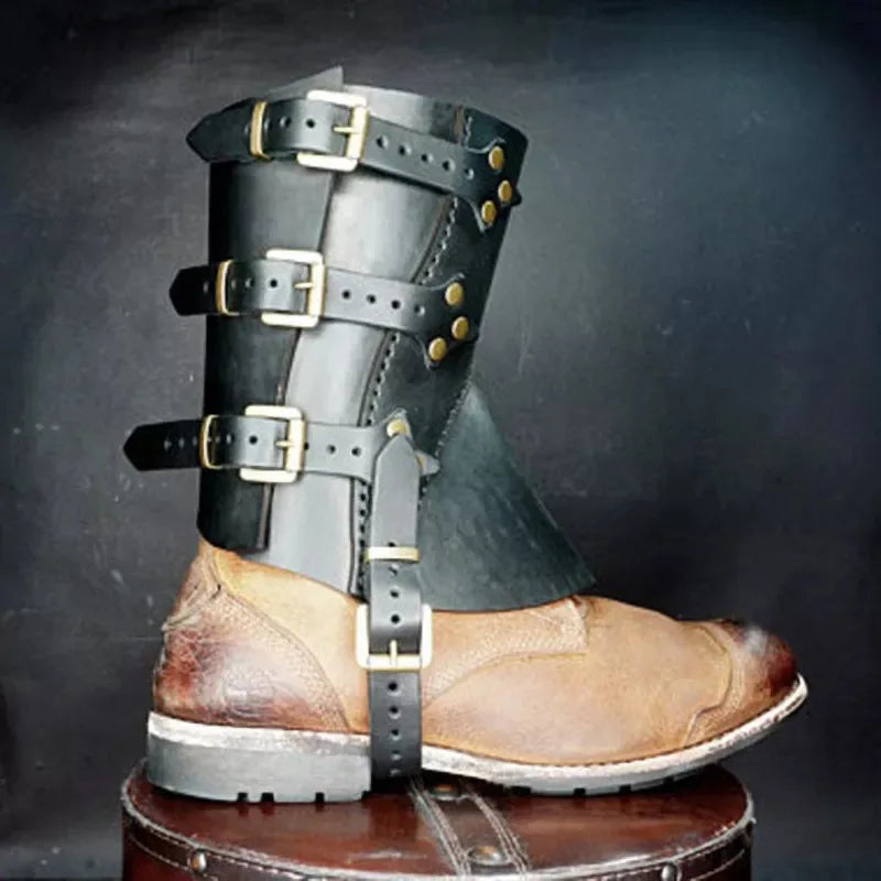 A brown leather shoe with an overlaid black leather brace featuring multiple straps and buckles is displayed against a dark background, reminiscent of historical costumes. This product is the 1 Pair Medieval Knight Warrior Gaiters Armor Leather Boot Shoes Cover Waterproof Leg Guards Renaissance Costume Accessory Larp by Maramalive™.