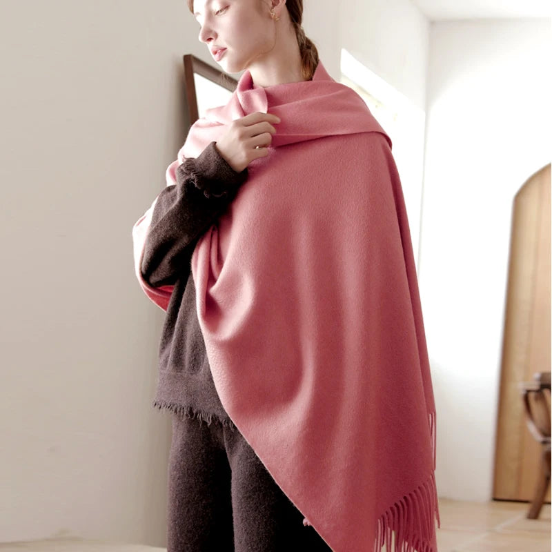 Woman in thick knitted light pink winter scarf