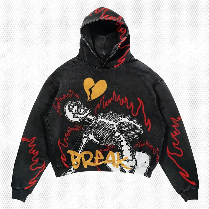 A Maramalive™ Explosions Printed Skull Y2K Retro Hooded Sweater Coat Street Style Gothic Casual Fashion Hooded Sweater Men's Female featuring a skeleton design with red flames, a heart with a crack, and "BREAK" text in yellow. The sleeves are also adorned with red flames, making it perfect for all four seasons.