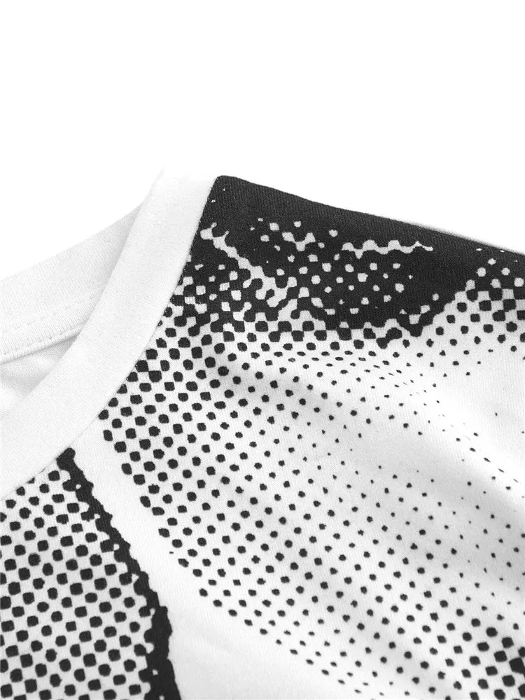 Close-up image of a white fabric with black dotted patterns, featuring a round neckline with a black and white design. Perfect for the Maramalive™ Grunge Graphic Print Long Sleeve Crop Tee Top Women Y2K Clothes Spring Goth High Street Style O-neck T Shirt Streetwear 2023, this piece adds a subtle touch of gothic flair to any outfit.