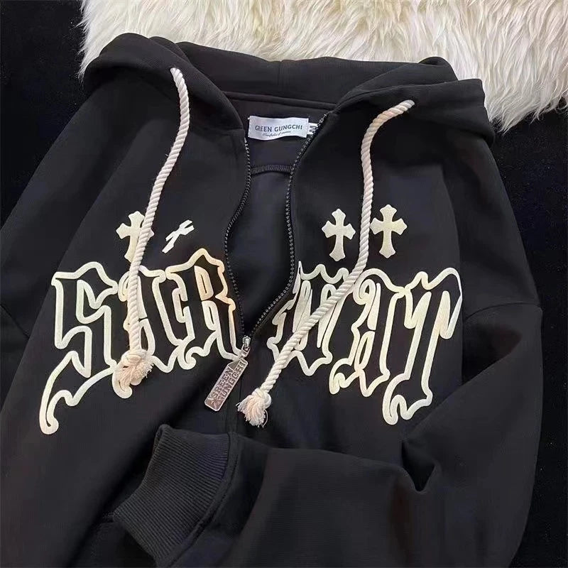A black hooded zip-up with a front zipper and white script reading "SICK WAIT" in gothic font. The Maramalive™ Goth Embroidery Hoodies Women High Street Retro Hip Hop Zip Up Hoodie Loose Man Sweatshirt Hoodie Clothes Y2K Hoodie has a white drawstring and is laid on a white fuzzy surface.