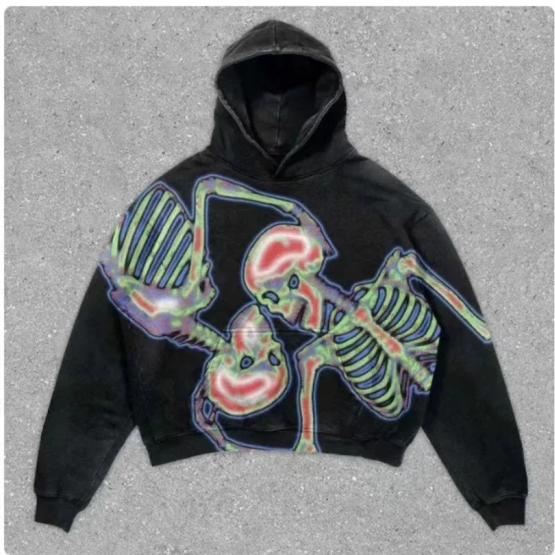 Black hoodie with a colorful, X-ray-style print of two skeletons intertwined on the front. Embrace the punk style with this must-have piece, the Maramalive™ Explosions Printed Skull Y2K Retro Hooded Sweater Coat Street Style Gothic Casual Fashion Hooded Sweater Men's Female, perfect for all four seasons and displayed on a gray textured background.