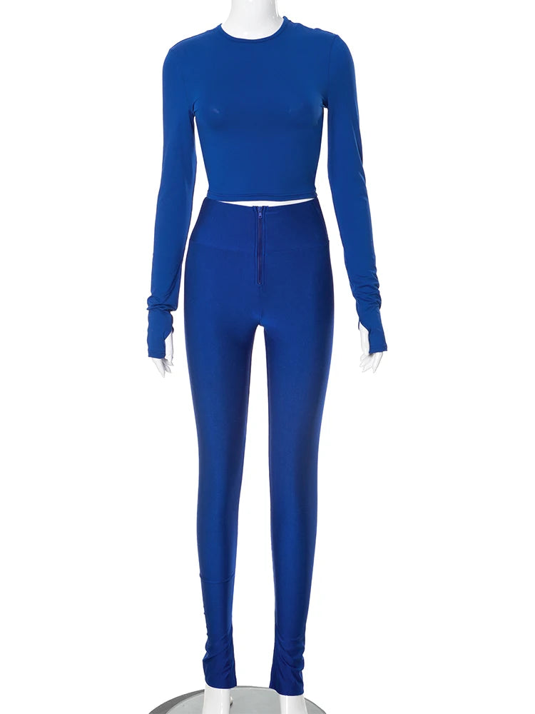 Mannequin dressed in a Casual Skinny Women 2Piece Set Round Neck Long Sleeve Crop Tops+Side Split Zipper Trousers Streetwear Matching Suits by Maramalive™, standing on a round platform, showcasing the essence of High Street Fashion for Autumn/Winter Clothing.