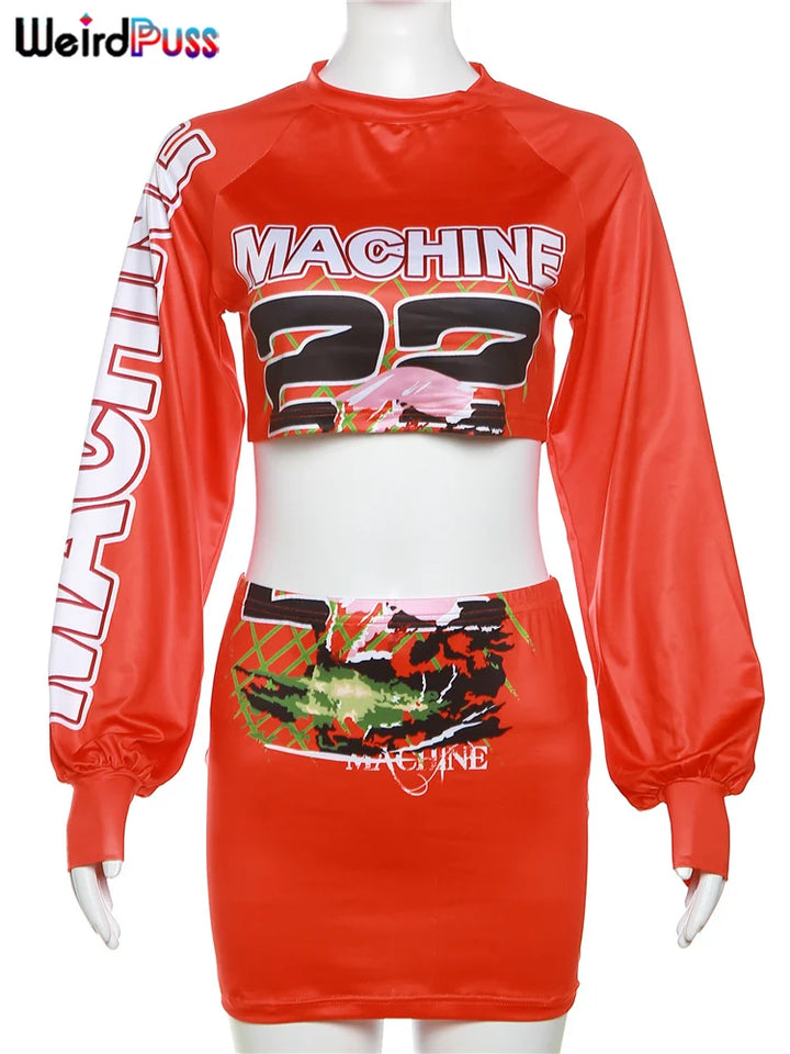 A mannequin displays a Letter Hipster 2 Piece Set Women Sporty Casual Skinny Lantern Sleeve Crop Tops+Skirts Trend Streetwear Matching Suits with "MACHINE 23" text and graphic designs on the front. The skirt features a colorful abstract pattern and an elastic waist for comfort. The brand Maramalive™ is prominently in the top left corner.