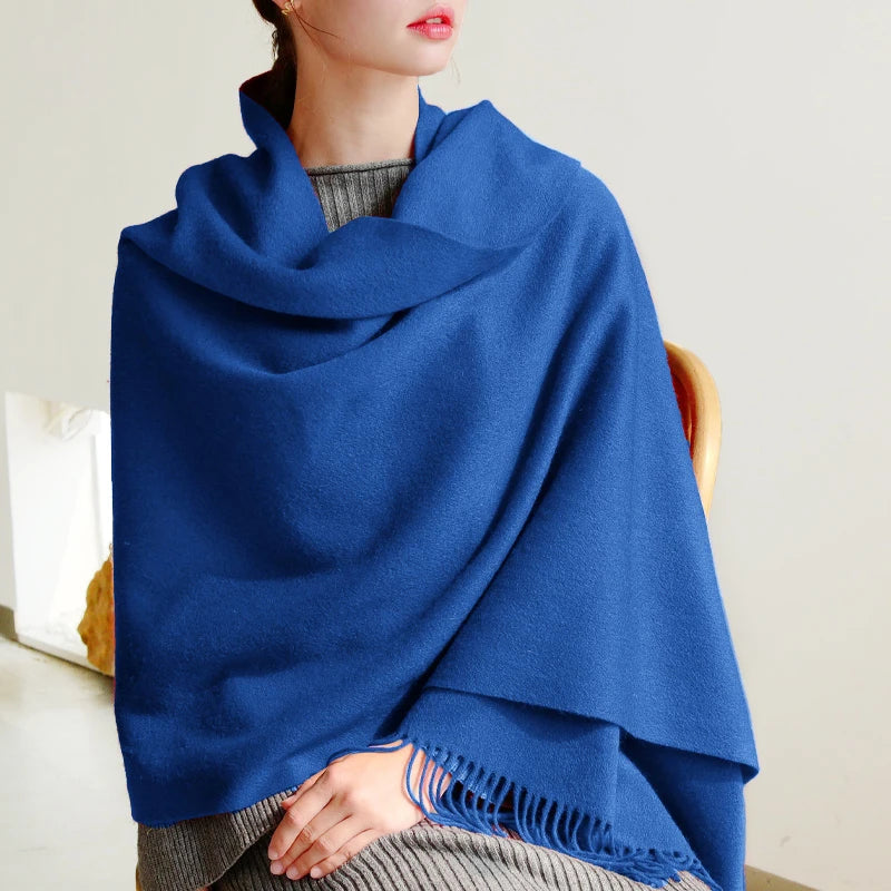 Woman in thick knitted blue winter scarf