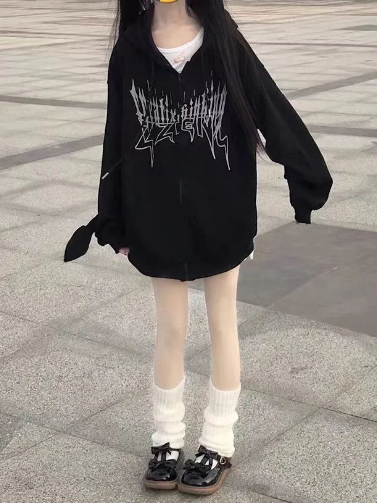 Person wearing a Maramalive™ Gothic Zip Up Hoodies Women Mall Goth Tops Streetwear Kawaii Hooded Sweatshirt 2022 Autumn Pullovers, white leggings, and white leg warmers, exuding a chic streetwear vibe while standing on pavement.
