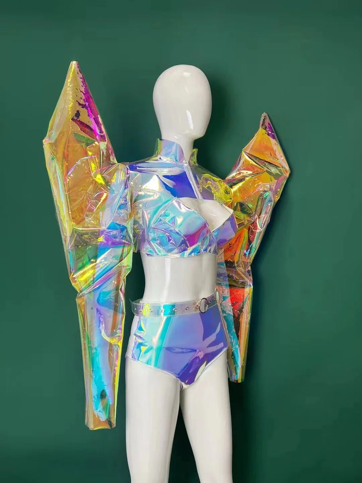 A mannequin dressed in a futuristic, iridescent outfit featuring exaggerated angular sleeves, a metallic bra top, and high-waisted bottoms stands against a green background, showcasing Maramalive™ ArmorCoat +Bikini Outfit Fantasy Armor Laser Personalized Performance Clothing Nightclub Bar Female Singer Sexy Party Outfit—cutting-edge women's fashion perfect for performance wear or a standout nightclub outfit.