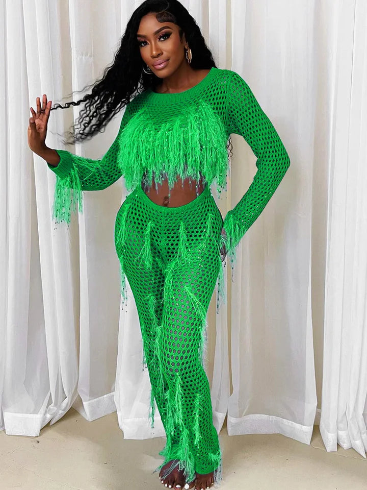49086425202962|49086425301266|49086426186002|49086426284306"Model in sparkly, sequined tassel green jumpsuit."