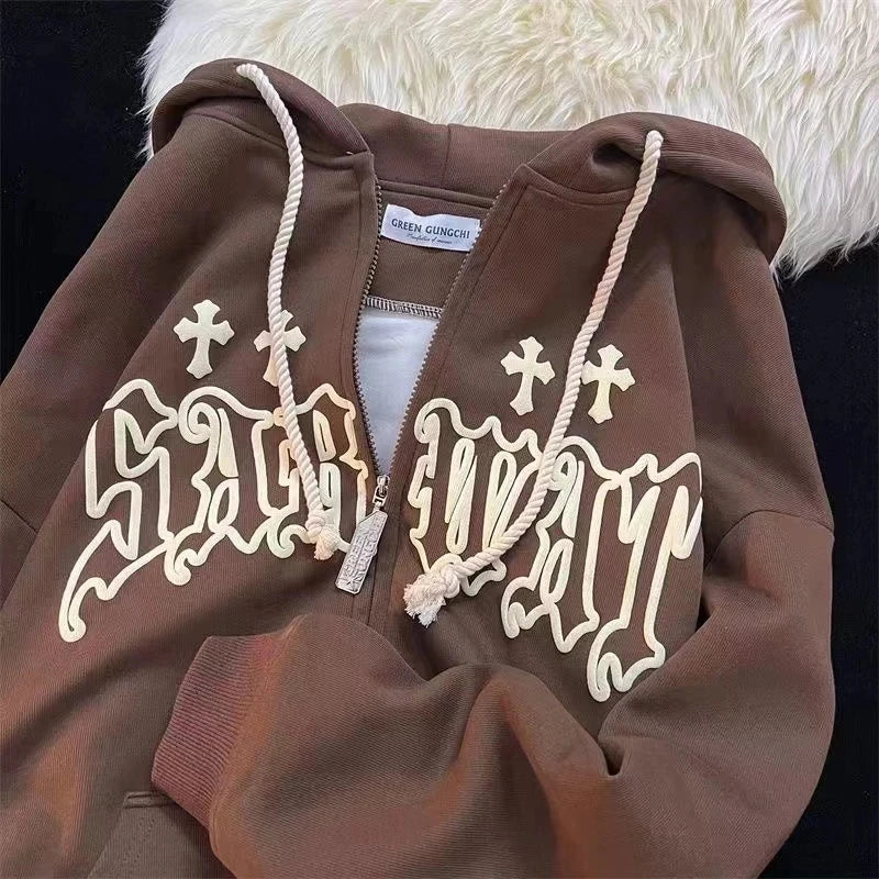 A Goth Embroidery Hoodies Women High Street Retro Hip Hop Zip Up Hoodie Loose Man Sweatshirt Hoodie Clothes Y2K Hoodie with large, stylized lettering on the front and rope-like white drawstrings. The hood is lined with white fur, adding a cozy touch to this streetwear piece from Maramalive™.