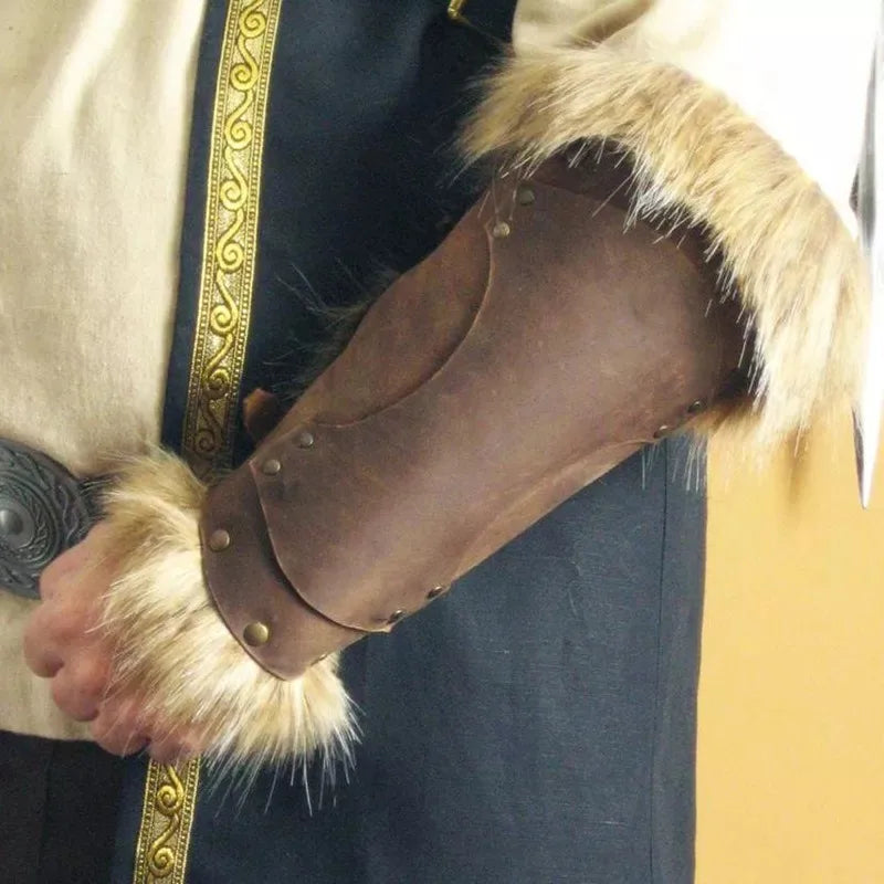 A person wearing a Maramalive™ Medieval Viking Warrior Leather Bracer Steampunk Fur Accents LARP Costume for Men Women Riveted Arm Armor Halloween Accessory on the shirt sleeve, perfectly completing their pirate costume ensemble.