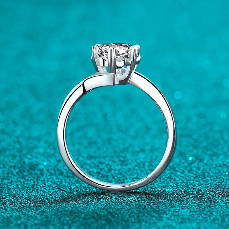 Moissanite engagement rings with diamond details.