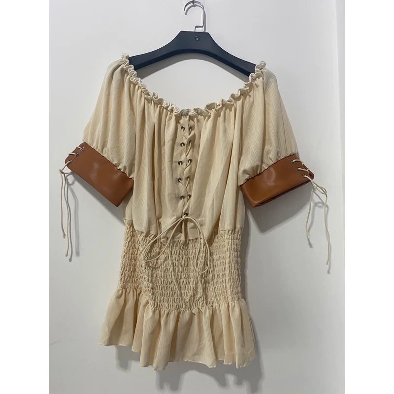 A beige Maramalive™ Medieval Women's Vintage Blouse Retro Steampunk Top Victorian Half Sleeve Off Shoulder Shirts Sweet Loose Clothes Female with a lace-up front, ruffled hem, and short sleeves accentuated with brown faux leather cuffs, perfect for medieval-inspired costumes.