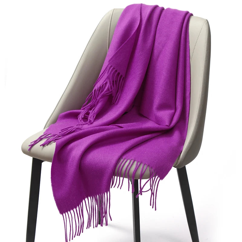 Purple thick knitted winter scarf draped on a chair