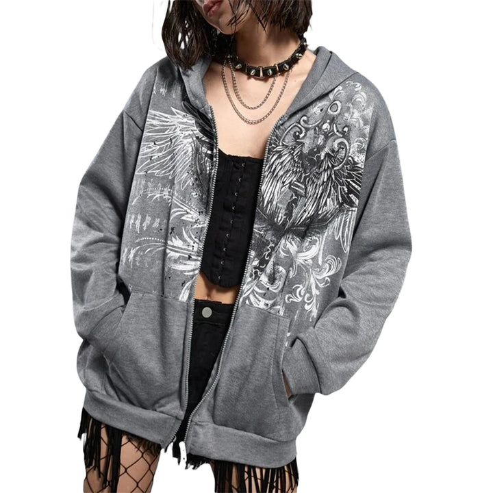 Person wearing a Maramalive™ E-girl Gothic Dark Academia Sweatshirts Grunge Punk Letter Wings Graphic Zip Up Hoodie Y2K Aesthetic Mall Goth Coat with a geometric pattern over a black corset top, accessorized with layered necklaces and a studded choker.