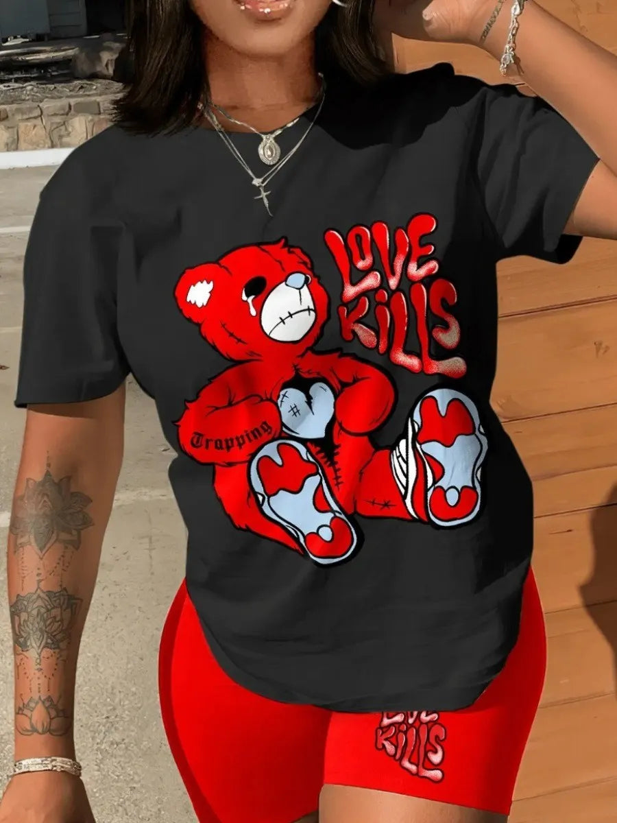 Person wearing a black t-shirt with a large graphic of a red, patched teddy bear and text "Love Kills." They are also sporting matching red shorts with the same text. This coordinated set from Maramalive™—the LW Plus Size Summer Casual 2 Piece Set Letter Print Shorts Set 2 Piece Outfit O Neck Short Sleeve T Shirt Top with short pants—offers both comfort and style for those embracing a bold, casual style.