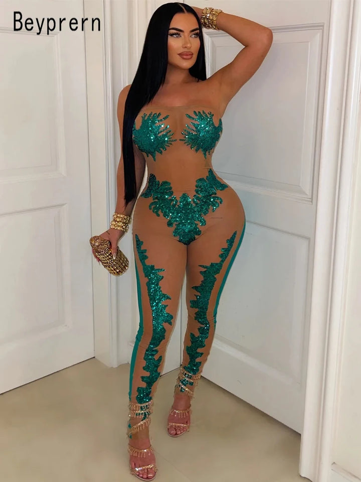 Model wearing Sparkling sequin and skin colored mesh romper in green