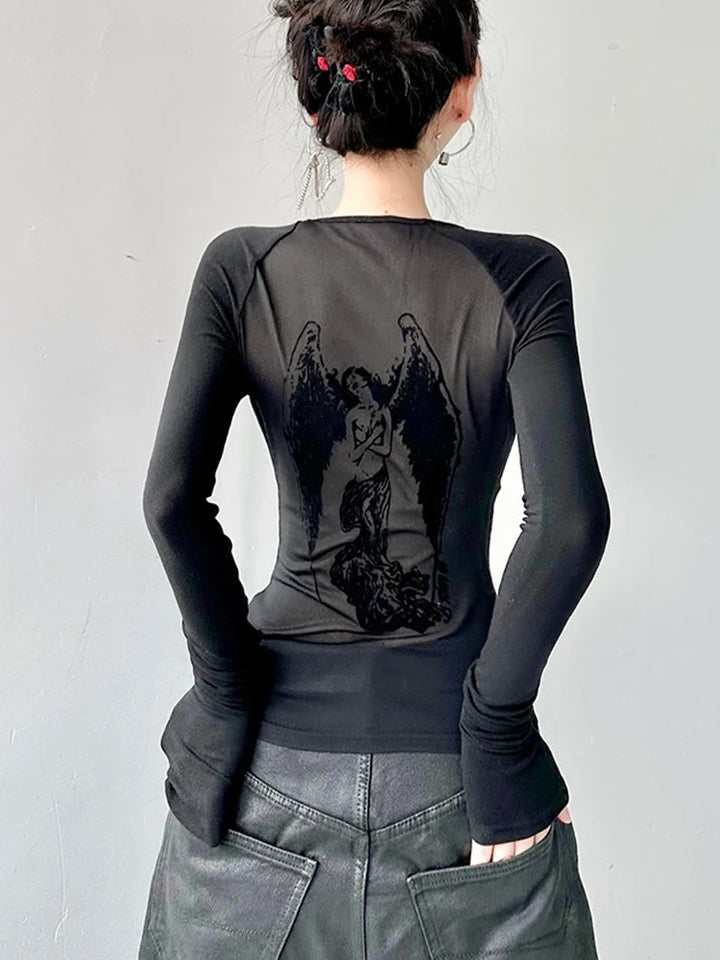 Person in a Maramalive™ Gothic See Through Angel Graphic Print T-shirt for Women Goth Punk Slim Fit Sexy Mesh Y2k Long Sleeve Grunge Transparent, featuring a back design with an angelic figure. They have dark hair tied up and are wearing dark pants. The background is plain gray.