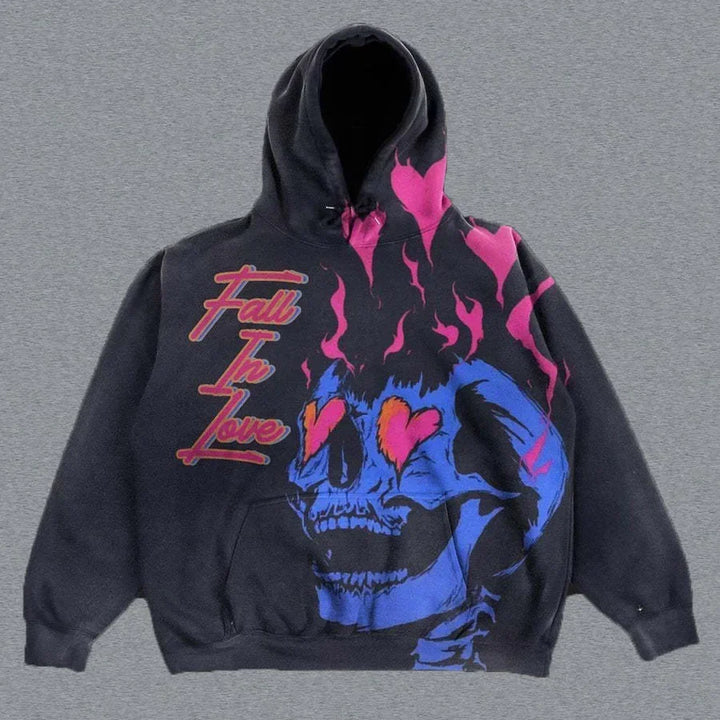 A black Maramalive™ Explosions Printed Skull Y2K Retro Hooded Sweater Coat Street Style Gothic Casual Fashion Hooded Sweater Men's Female with a graphic of a blue skull with pink flaming eyes and text that reads "Fall in Love" in red cursive. This punk style hoodie features a blend of pink and blue design elements, making it a standout piece in men's clothing.