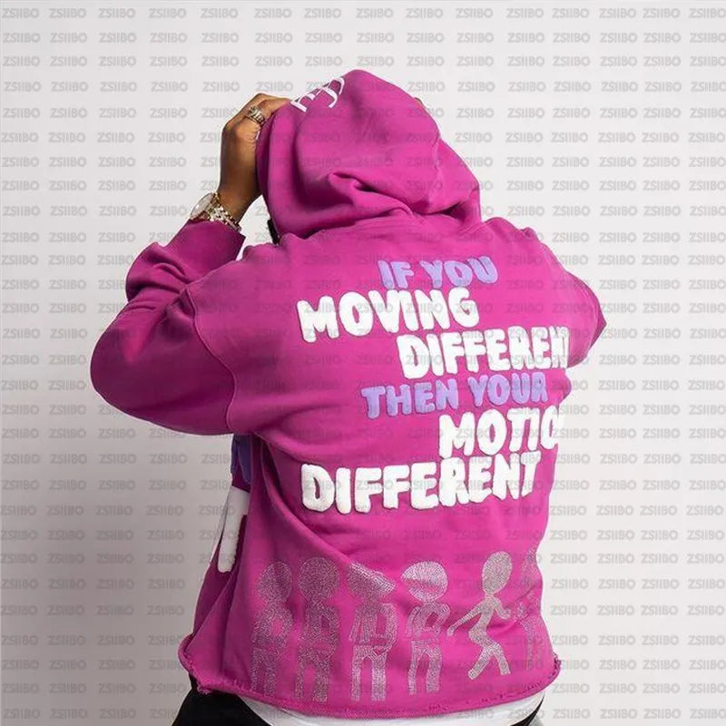 Person wearing a bright pink **Maramalive™ High Street Y2K Hoodie Women Gothic 90s Print Hoodie Kpop Streetwear Sweatshirt Vintage Clothing Punk Loose Hip Hop Jacket Top** with the text "If you moving different then your motion different" on the back, posing with their hands near their head against a patterned background, showcasing chic Autumn/Winter fashion.