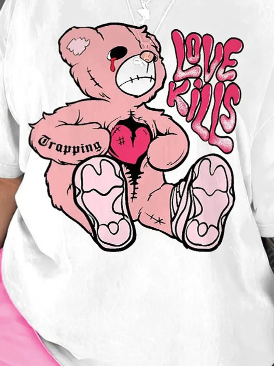 A white t-shirt from Maramalive™ featuring a distressed pink teddy bear holding a red heart with cuts, the words "Love Kills" in stylized text above, and "Trapping" written on the bear's left arm. Perfect for casual style, it offers high stretch for ultimate comfort. This is part of the LW Plus Size Summer Casual 2 Piece Set Letter Print Shorts Set 2 Piece Outfit O Necke Short Sleeve T Shirt Top with short pants.