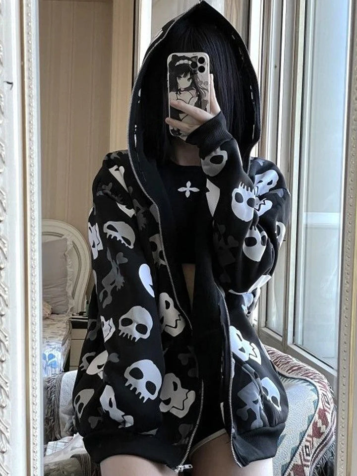 Person taking a mirror selfie wearing a Maramalive™ Cyberpunk Y2k Sweatshirt Women Mall Goth Skull Printed Long Sleeve Zipper Cardigan Hoodie Emo Alt Indie Clothes with white skull patterns and holding a phone with an anime character case.