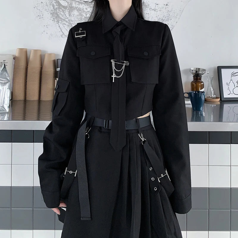 Person wearing Maramalive™ EMO Gothic Cargo Shirt Suit Egirl Punk Chain Ribbon Skirts Goth Dress Autumn Streetwear Black Grunge Aesthetic Clothes, standing in front of a tiled counter with disposable cups and a blue mug.