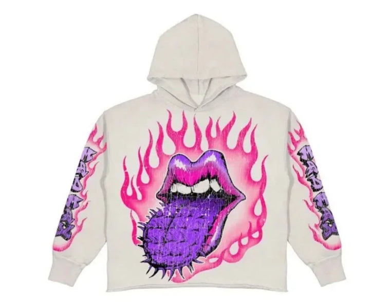 A light-colored polyester Maramalive™ Explosions Printed Skull Y2K Retro Hooded Sweater Coat Street Style Gothic Casual Fashion Hooded Sweater Men's Female featuring a graphic design of purple lips with a thorny tongue surrounded by pink flames on the front. Embracing the punk style, flame patterns and edgy text are also present on the sleeves.