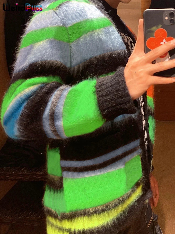Person taking a mirror selfie wearing a colorful, fuzzy striped Maramalive™ 2022 Cardigan Sweater Y2K Women Button Contrast Color Patchwork V-Neck Lantern Sleeve Top Street Hipster Loose Coat in shades of green, black, blue, and grey.