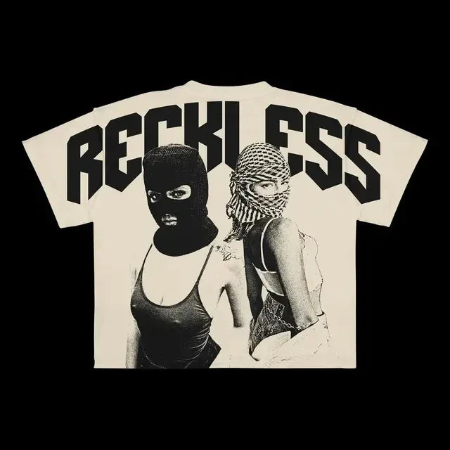 A beige Maramalive™ Punk Hip Hop Graphic T Shirts Mens Vintage Y2k Top Goth Oversized T Shirt Fashion Loose Casual Short Sleeve Streetwear with "RECKLESS" printed on the back in bold black letters, featuring an image of two women wearing swimsuits and balaclavas.