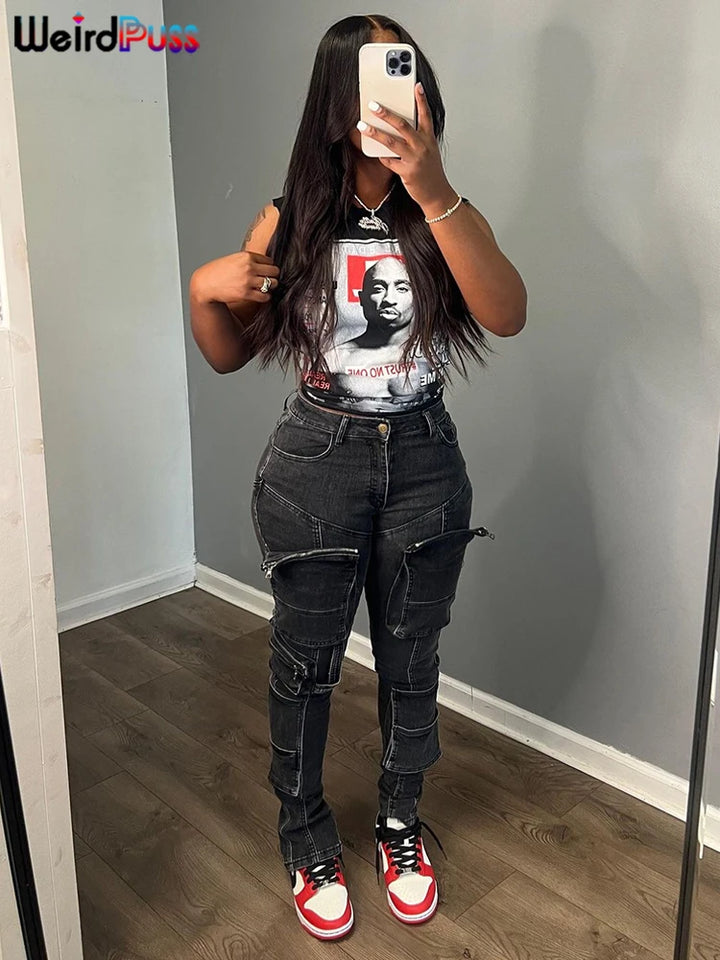 A person with long hair takes a mirror selfie while wearing a black graphic t-shirt from Maramalive™, black pants with multiple pockets and zippers, and red, white, and black sneakers. A "Maramalive™" logo is in the top left corner.