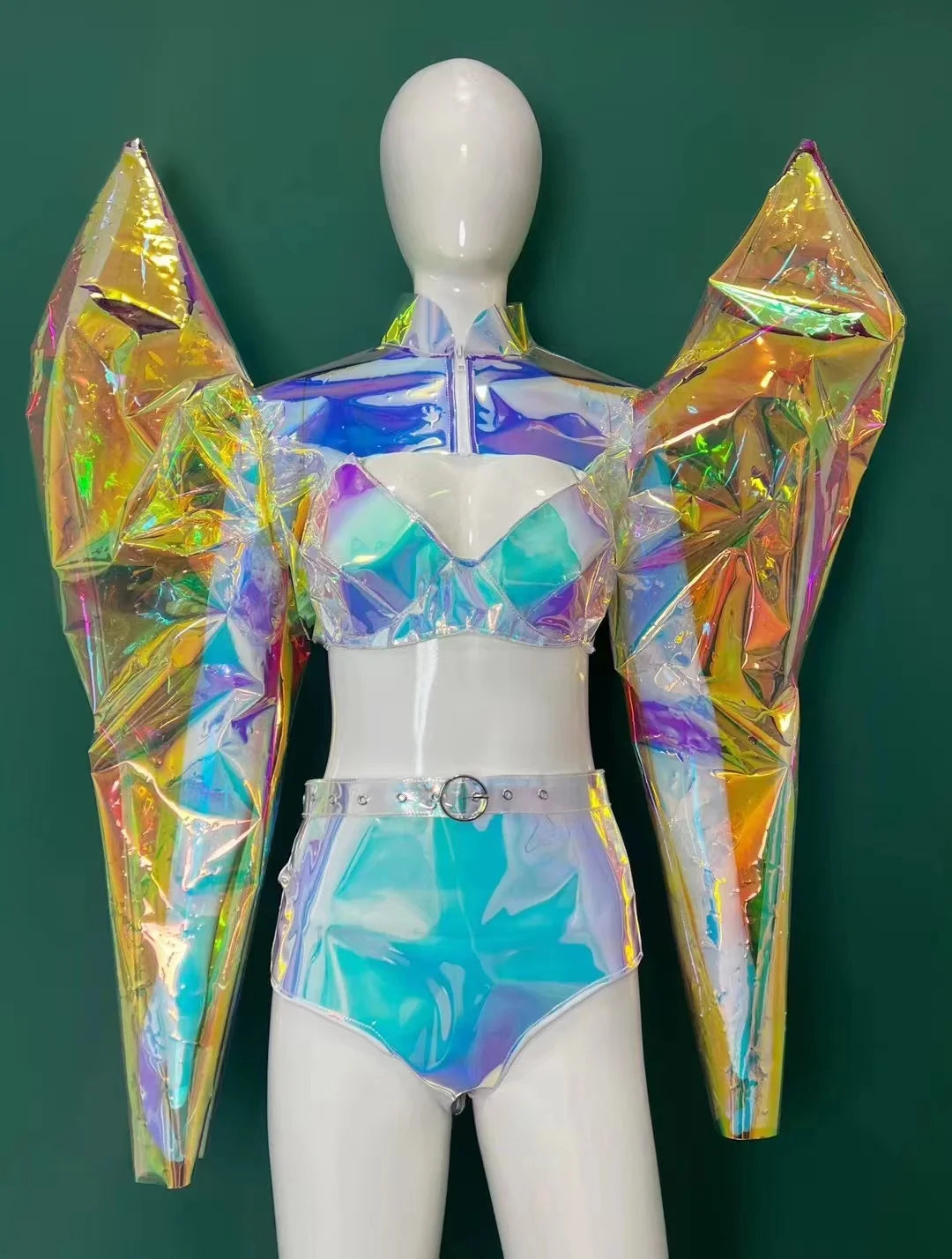A mannequin dressed in a Maramalive™ ArmorCoat +Bikini Outfit Fantasy Armor Laser Personalized Performance Clothing Nightclub Bar Female Singer Sexy Party Outfit with oversized angular sleeves, a crop top, and high-waisted shorts, stands against a green background.