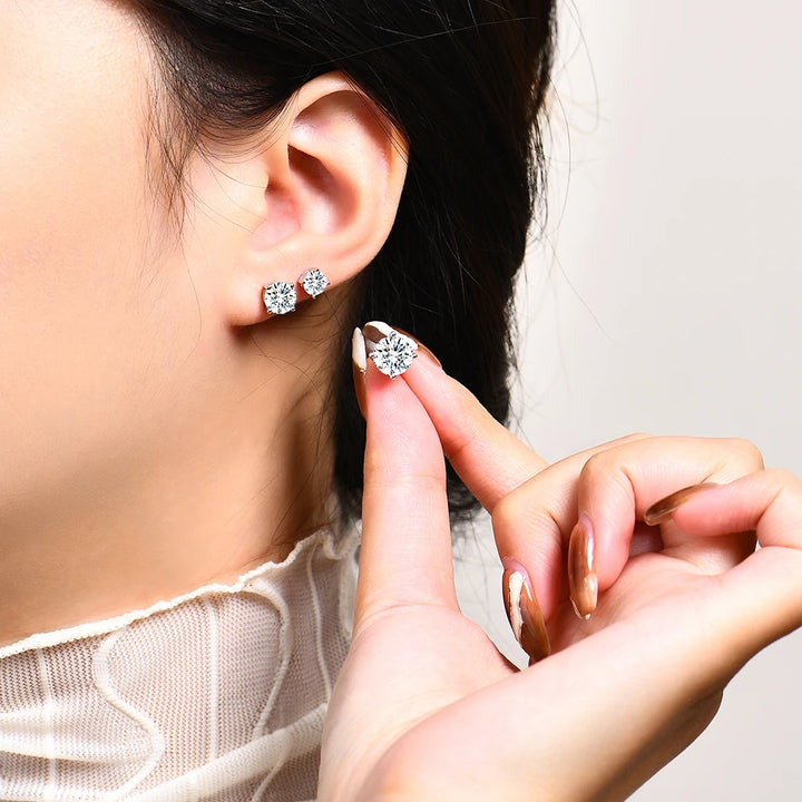 Sterling silver moissanite stud earrings.
