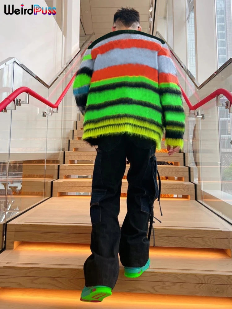 Person wearing a colorful, striped, oversized Maramalive™ 2022 Cardigan Sweater Y2K Women Button Contrast Color Patchwork V-Neck Lantern Sleeve Top Street Hipster Loose Coat and black pants, walking up a staircase with red railings. The word "Maramalive™" is displayed in the top left corner.