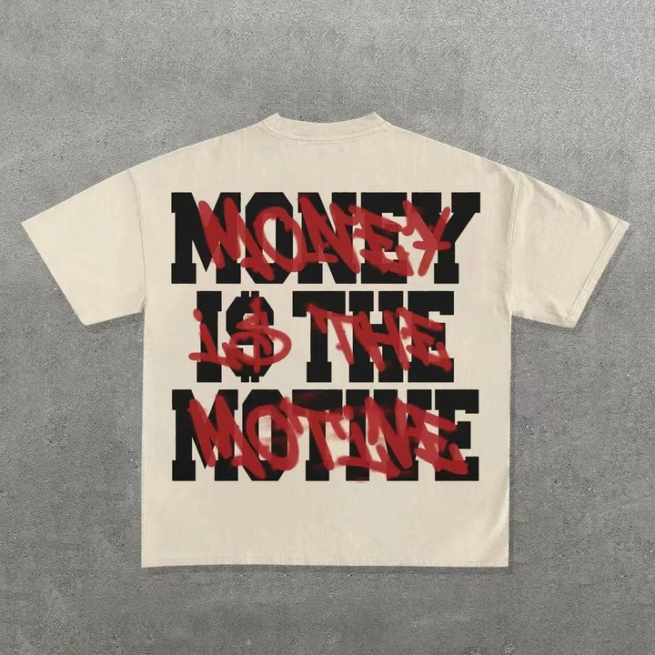 Vintage Y2k top with black block letters spelling "MONEY IS THE MOTIVE" and red spray paint-style text overlaying the message. The Maramalive™ Punk Hip Hop Graphic T Shirts Mens Vintage Y2k Top Harajuku Goth Oversized T Shirt Fashion Loose Casual Short Sleeve Streetwear is laid out on a gray concrete surface.