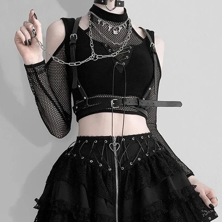 Person wearing a Maramalive™ Goth Dark Techwear Fishnet Open Shoulder Halter T-shirts Mall Gothic Grunge Black Bandage Crop Tops Women Punk Sexy Alt Clothing with fishnet patchwork sleeves, chains, harness, and a black choker, posing sideways with one arm lifted.