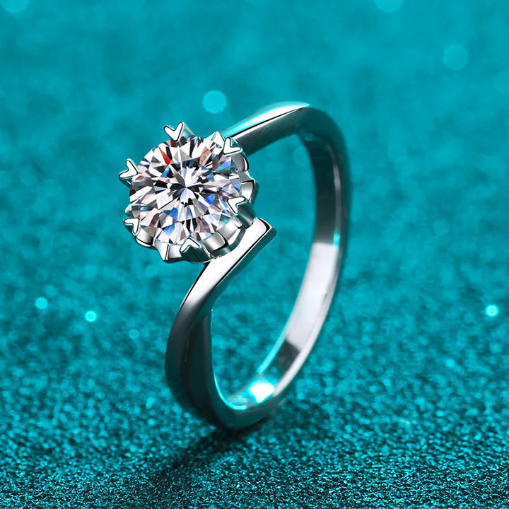 Moissanite engagement rings with diamond details.