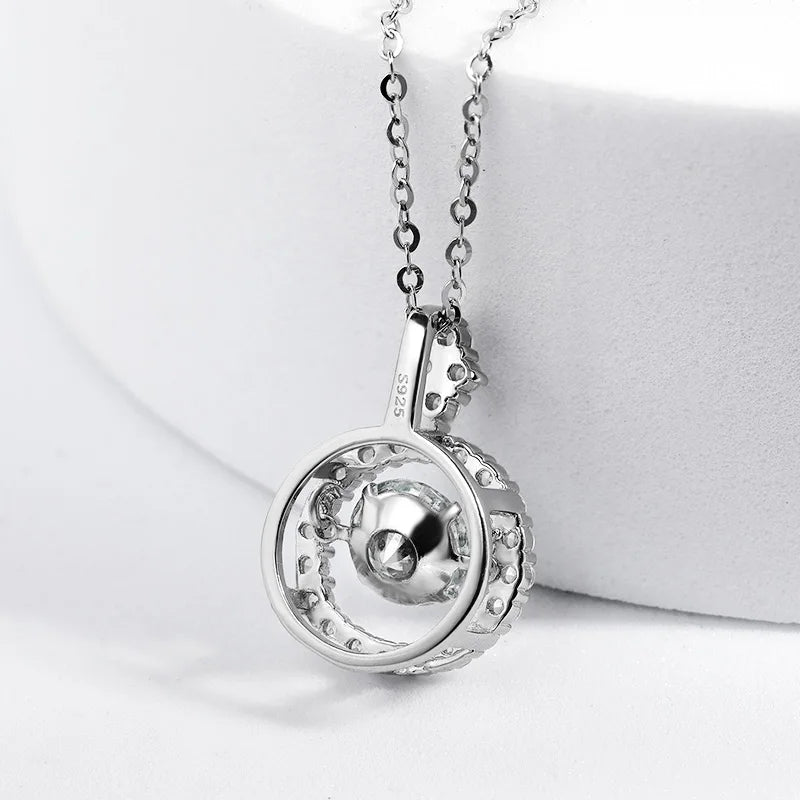 A 925 sterling silver necklace with a spherical design, featuring a circular outer ring and a central sphere, displayed on a white background. This Maramalive™ 1/0.8 CT Moissanite Pendant For Women Simulated Diamond Necklace S925 Sterling Silver Jewelry Girl Valentine's Day Gift adds an elegant touch to any outfit.