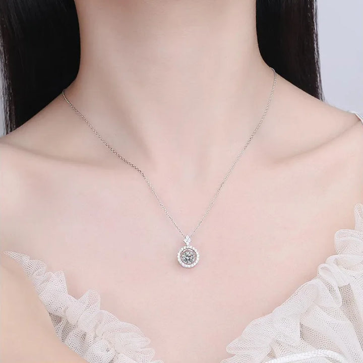 Women's round moissanite pendant necklace.