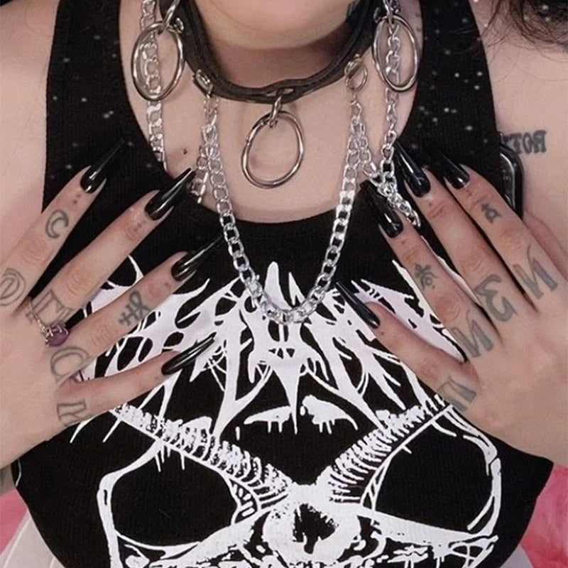 Person wearing a Maramalive™ Black Tank Tops For Women Knitted Grunge Punk Goth Goat Head Print Vest Y2k Clothes Crop Top Summer Sexy Sleeveless O-neck Tanks with a graphic design and multiple silver chains and rings around their neck. They have tattoos and long black nails, exuding an edgy vibe.