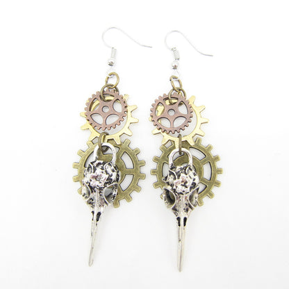 A pair of Maramalive™ Women's Handmade Retro Gear Steampunk Earrings with gears and a skull.
