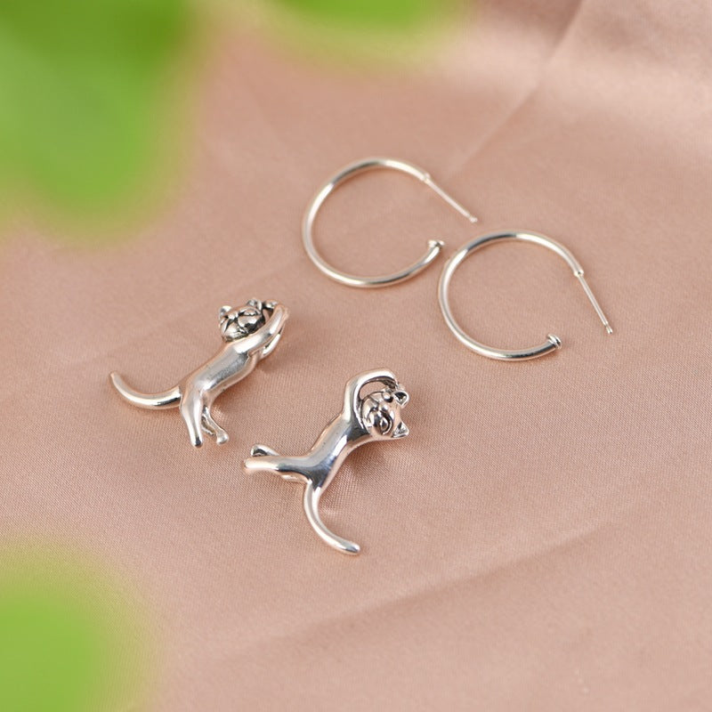 A pair of Retro Fashion Minimalism Design Kitten Earrings with a cat on them, from Maramalive™.
