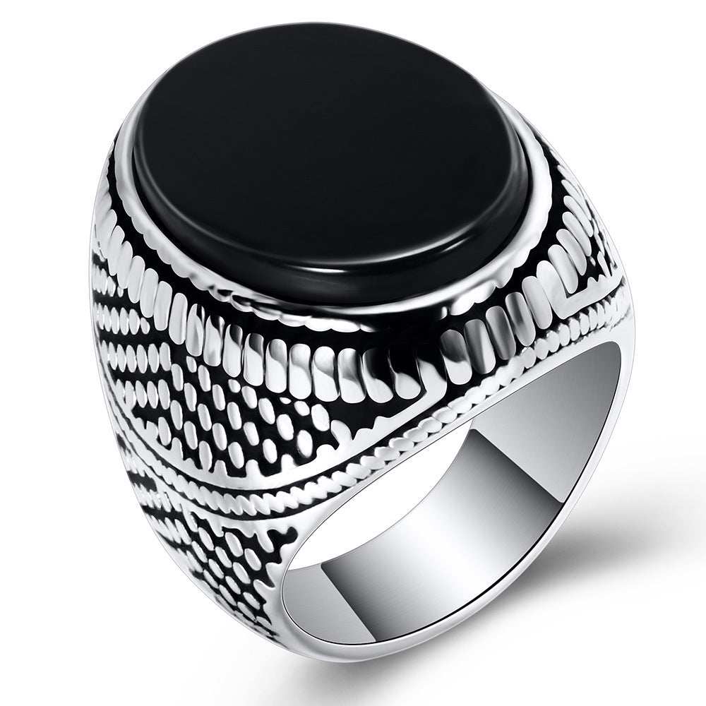 A European And American New Black Onyx Retro Ring Men's Fashion Ring on a brown cloth by Maramalive™.