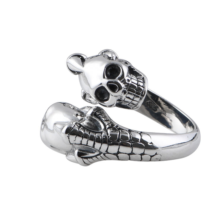 A person is holding a Retro Skull Adjustable Silver Ring with a skull on it from Maramalive™.