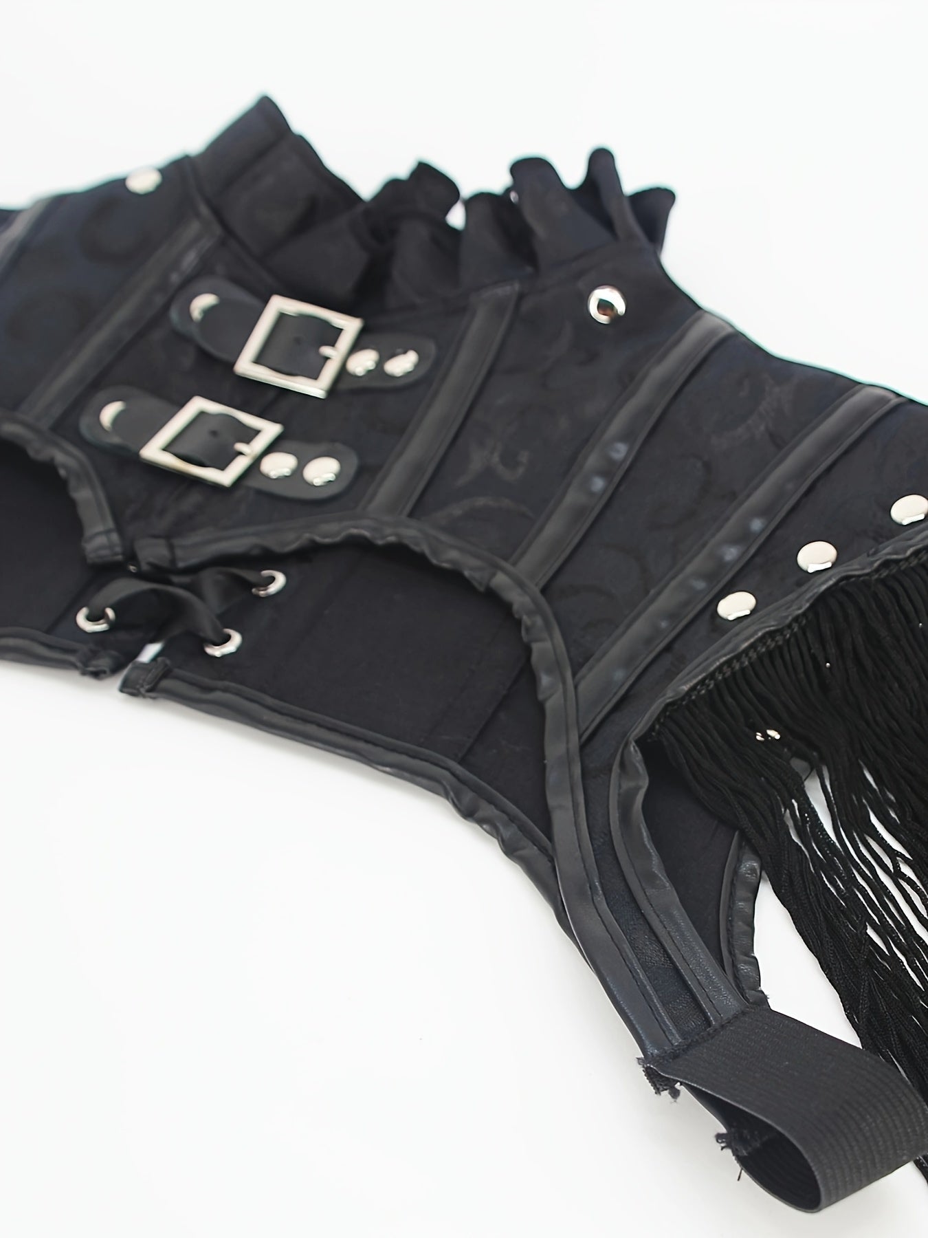 Black steampunk-style Fringe Hem Ruffle Trim Crop Top, Punk Mock Neck Buckle Lace Up Shrug, Women's Clothing from Maramalive™ with silver buckles, lace-up details, and fringe accents, featuring a stand collar and double button design, laid flat on a white background.