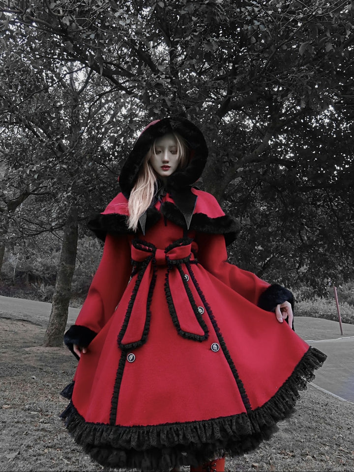 A woman wearing a red coat and black boots, adding gothic elements with the Maramalive™ Gothic Christmas Cloak for Women - Dark Victorian Cape.