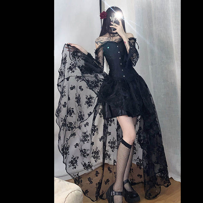 A woman in the Maramalive™ Dress to Rule the Dark Kingdom - Sinister Royalty Corset Gown and stockings.