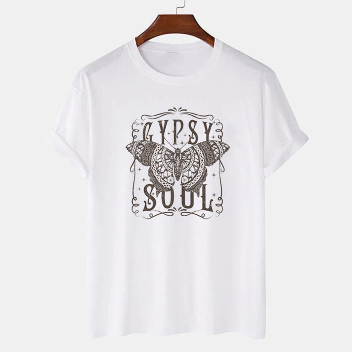 A woman wearing a black Bohemian Gypsy Soul Tee - Bohemian Gypsy Soul Tee - Butterfly Loose T-shirt by Maramalive™.