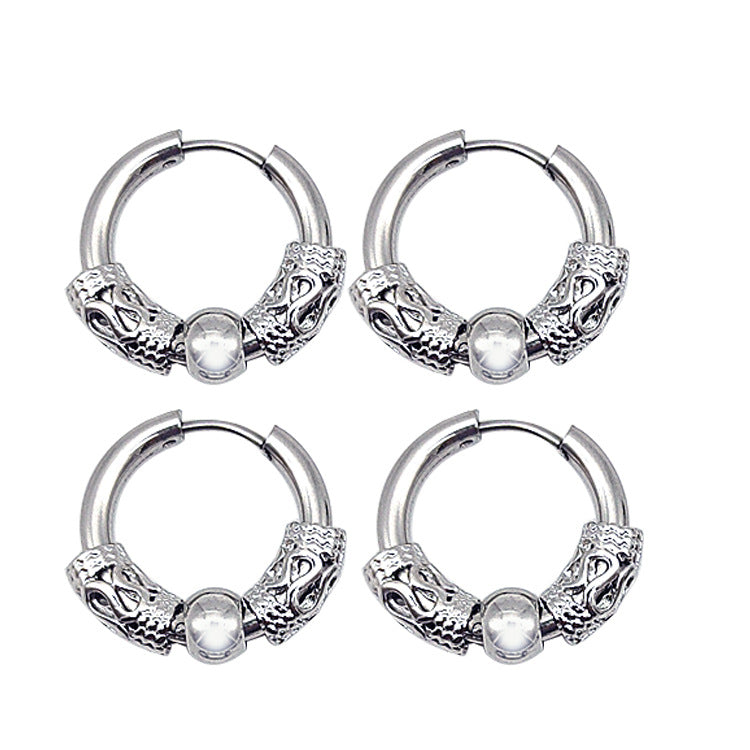 A pair of Dragon Totem Hoop Earrings - Men by Maramalive™ with skulls on them.