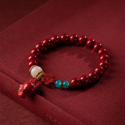 A woman wearing a Maramalive™ Women's Fashion Simple Red Flower Fox Bracelet.
